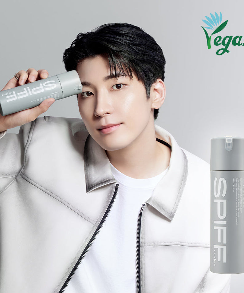 Gentleman Korea model holding THE FACE SHOP Speed Code Perfect All-in-One Fluid 145ml bottle showcasing vegan men’s skincare