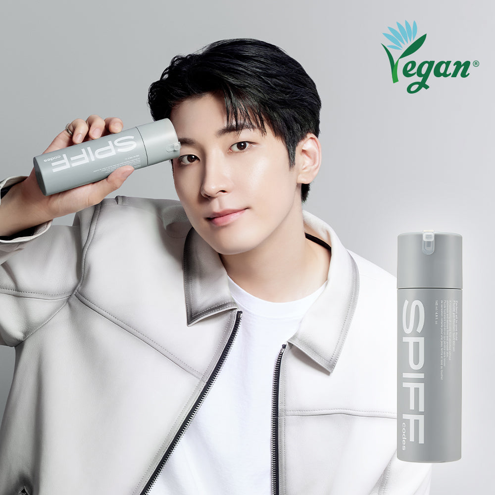 Gentleman Korea model holding THE FACE SHOP Speed Code Perfect All-in-One Fluid 145ml bottle showcasing vegan men’s skincare