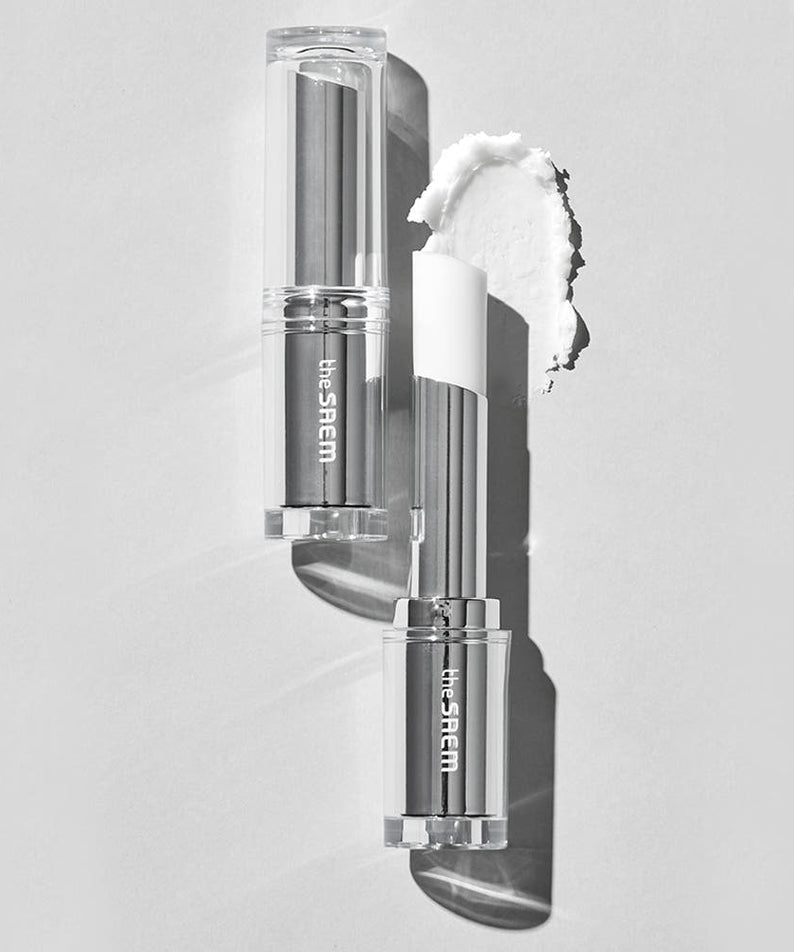 THE SAEM Soft Blurring Primer Lip Balm in clear packaging on monochrome background, showcasing texture and color.