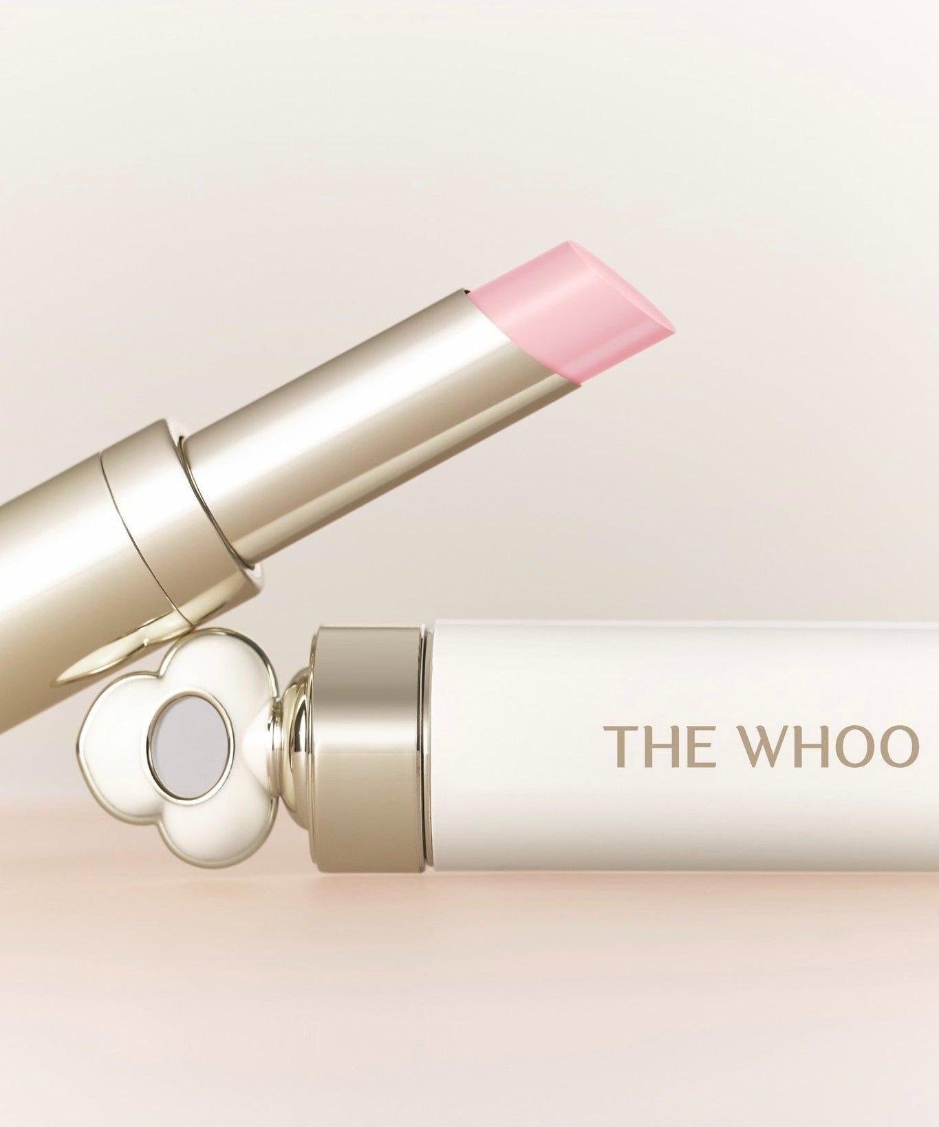 THE WHOO Essentail Lip Glow Balm in elegant packaging, highlighting its smooth texture and luxurious design.