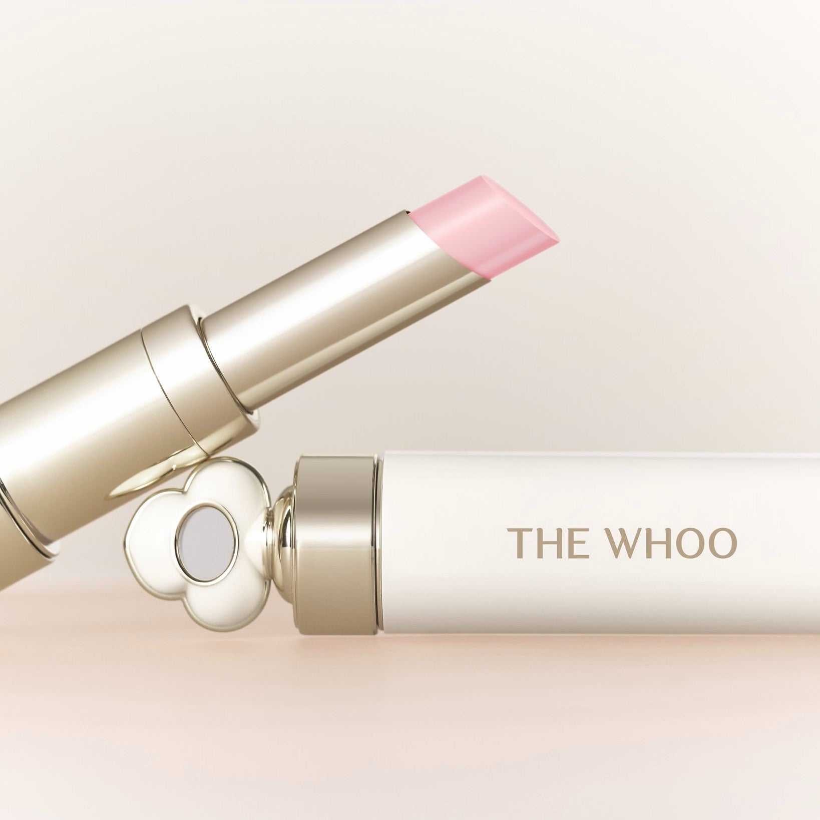 THE WHOO Essentail Lip Glow Balm in elegant packaging, highlighting its smooth texture and luxurious design.