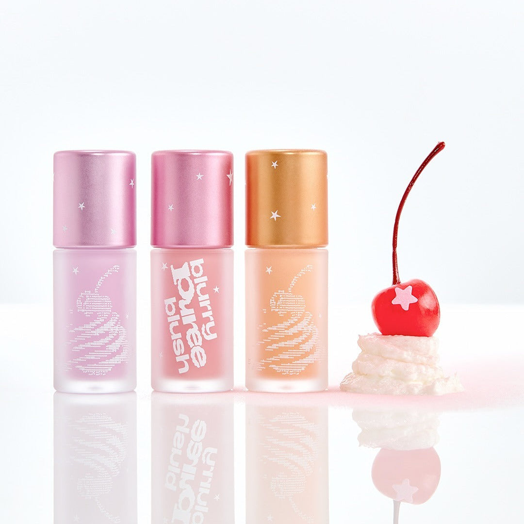 TIP TOE Blurry Puree Blusher bottles displayed with cherry and cream design, showcasing colorful cosmetic packaging.