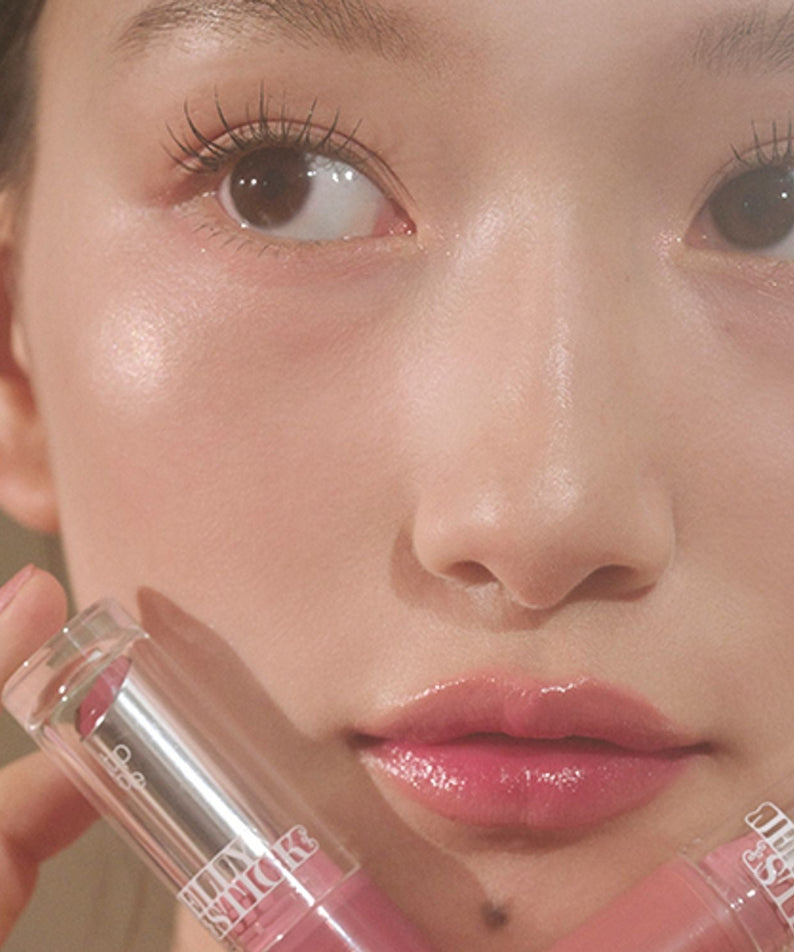 Close-up of a model showcasing TIP TOE Jelly Stick Plan with radiant, glossy lips and clear complexion.
