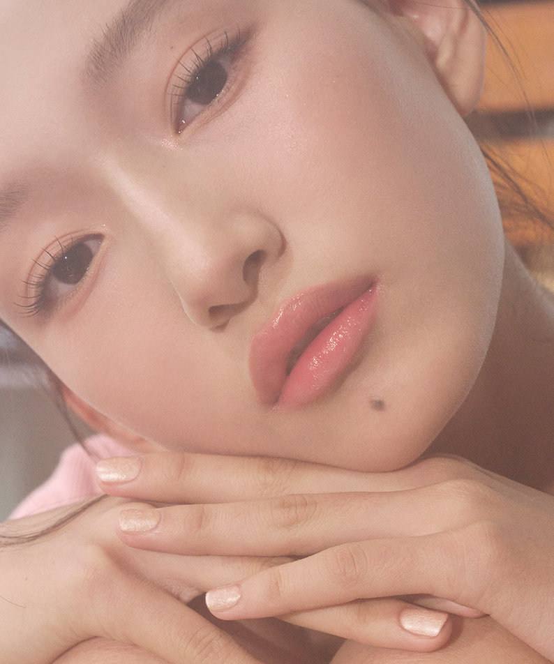 Model wearing TIP TOE Matte Glitter Nail Polish on nails.
