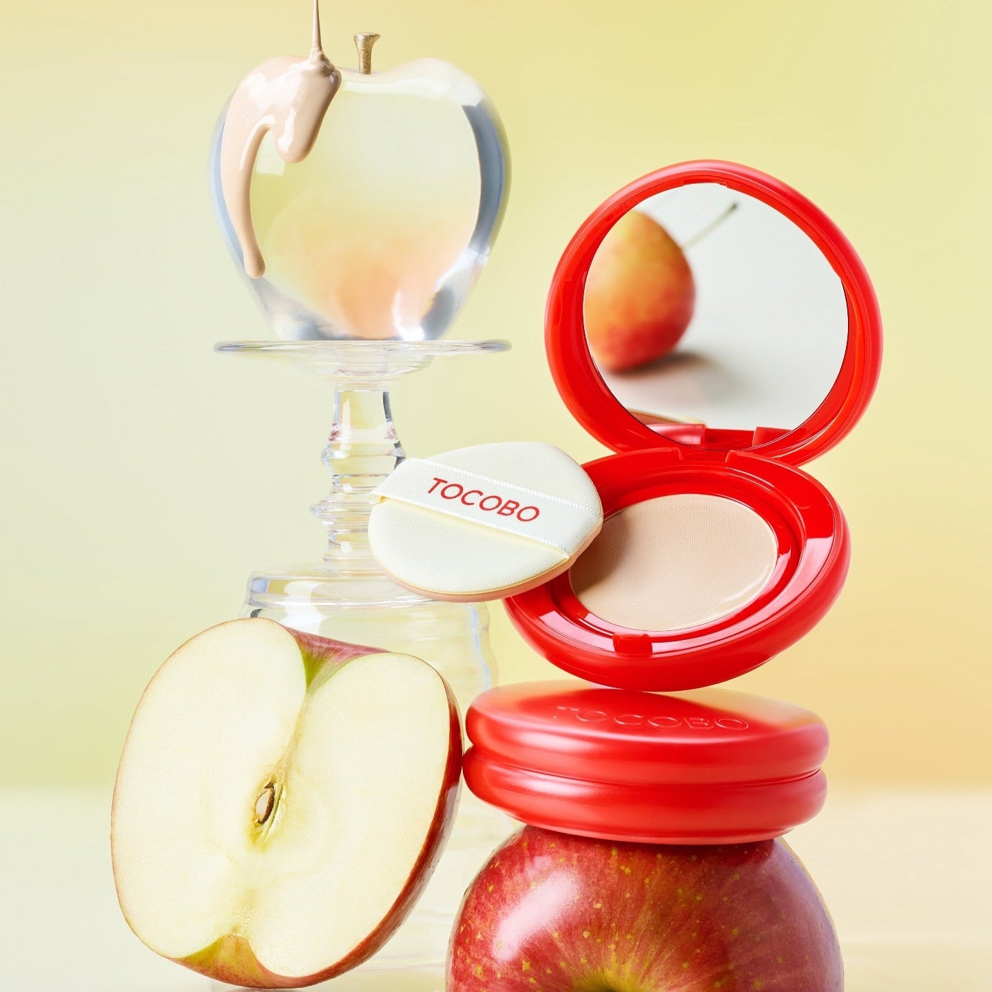 TOCOBO Apple Dewy Fit Cushion in a vibrant red compact with apples and dewy apple visual, highlighting its fresh and glowing finish.