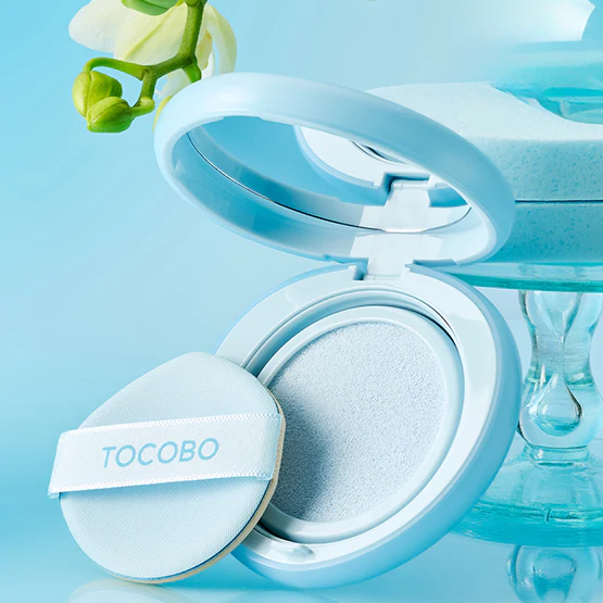 TOCOBO Blur Finish Sun Cushion in light blue compact with flower accent, offering a smooth sun protection experience.
