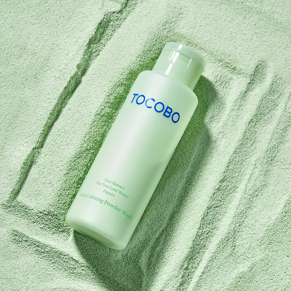 TOCOBO Cica Calming Powder Wash in green bottle against matching textured background