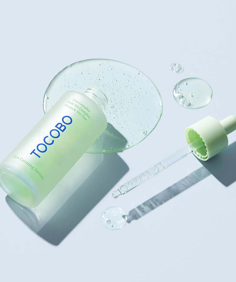 TOCOBO Cica Calming Serum bottle and dropper with serum droplets on a light background