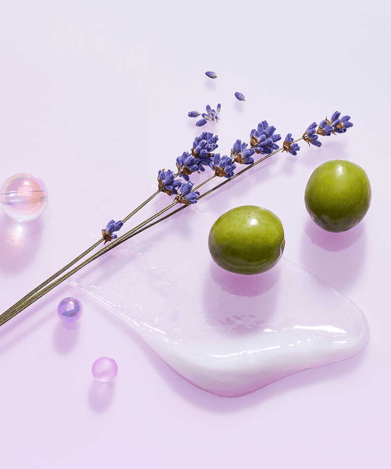 TOCOBO Collagen Boosting Lip Mask ingredients including lavender and natural elements on a pastel background.