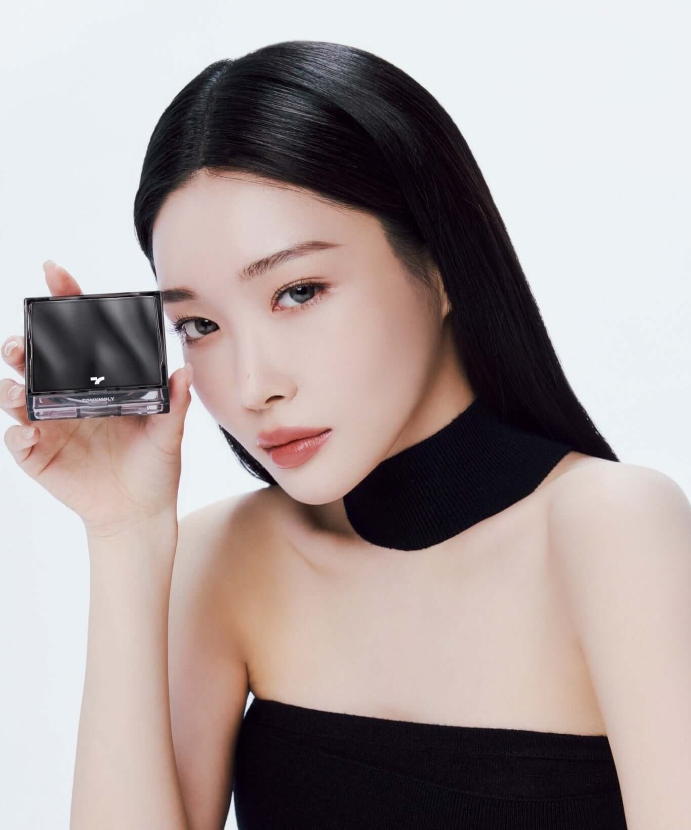 Model showcasing TONY MOLY Skin Tone Fixing Cover Cushion in a stylish beauty shoot.
