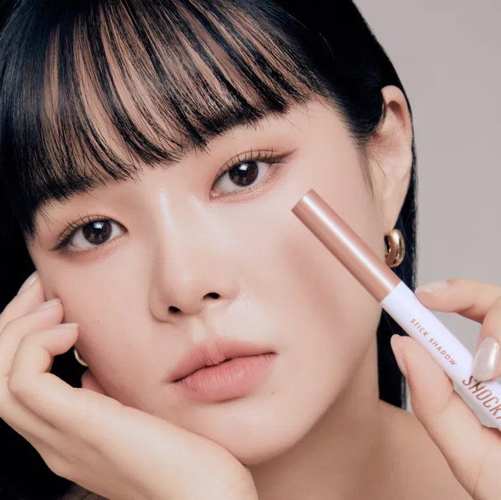 Model demonstrating TONY MOLY The Shocking Color Fixing Stick Shadow for eye makeup.