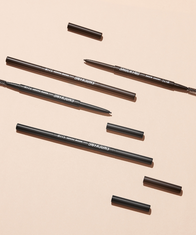 TONY MOLY The Shocking Vegan Brow Sharp Slim eyebrow pencils on a beige background.