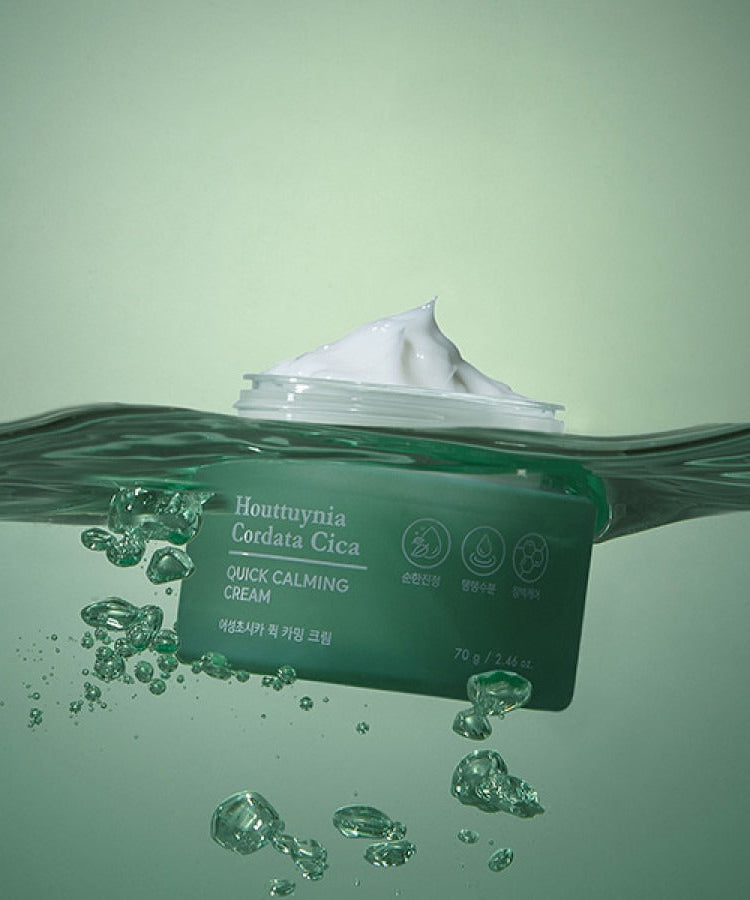 TONYMOLY Houttuynia Cordata Cica Quick Calming Barrier Cream 70g in water with cream texture visible, soothing skincare product.