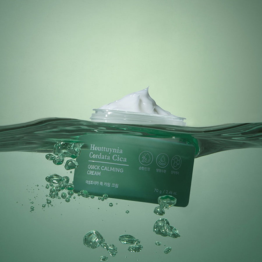 TONYMOLY Houttuynia Cordata Cica Quick Calming Barrier Cream 70g in water with cream texture visible, soothing skincare product.
