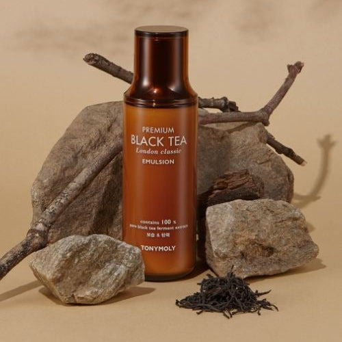Image of TONYMOLY Premium Black Tea London Classic Emulsion 150ml bottle with natural stone and twig setting