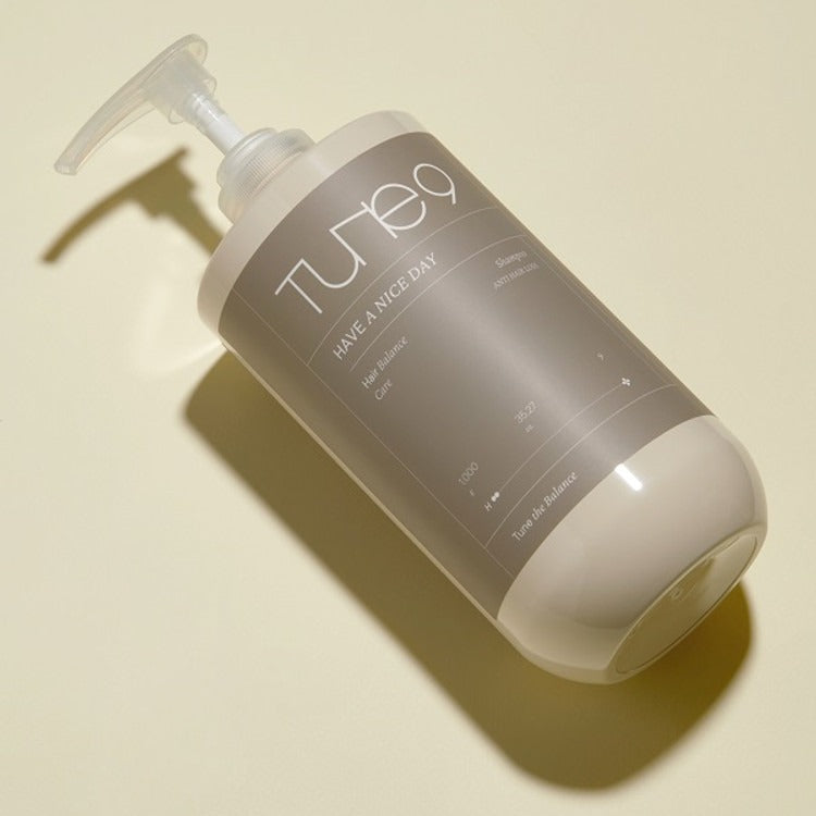 TONYMOLY Tune 9 Have A Nice Day Shampoo 1000g bottle on a beige background