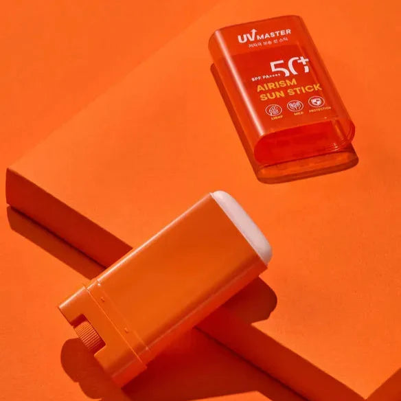 TONYMOLY UV Master Airism Sun Stick 20g displayed on an orange background showcasing its sleek design and SPF 50+ protection.
