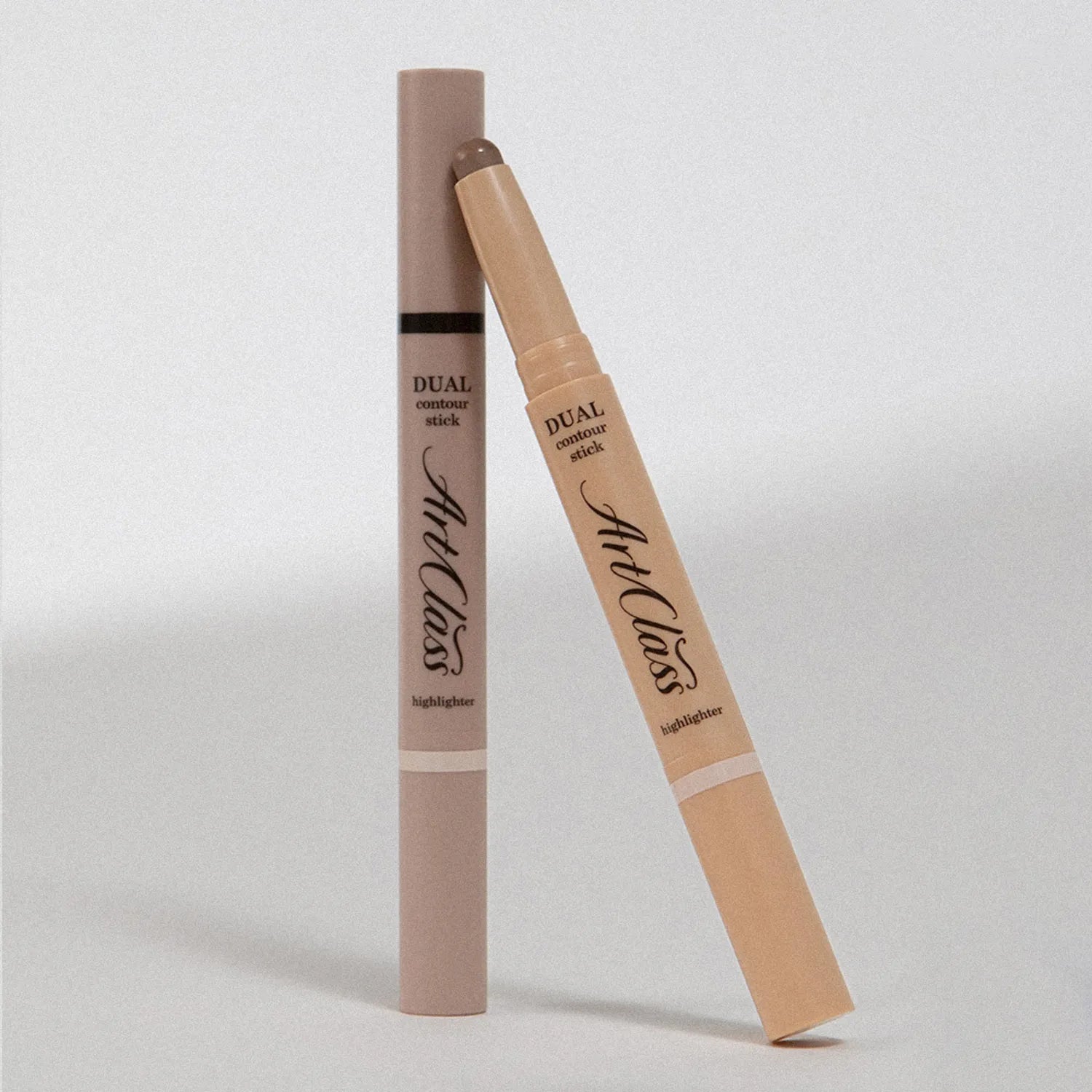 TOO COOL FOR SCHOOL By Rodin Dual Contour Stick in packaging, highlighting the contouring and highlighting dual functionality.