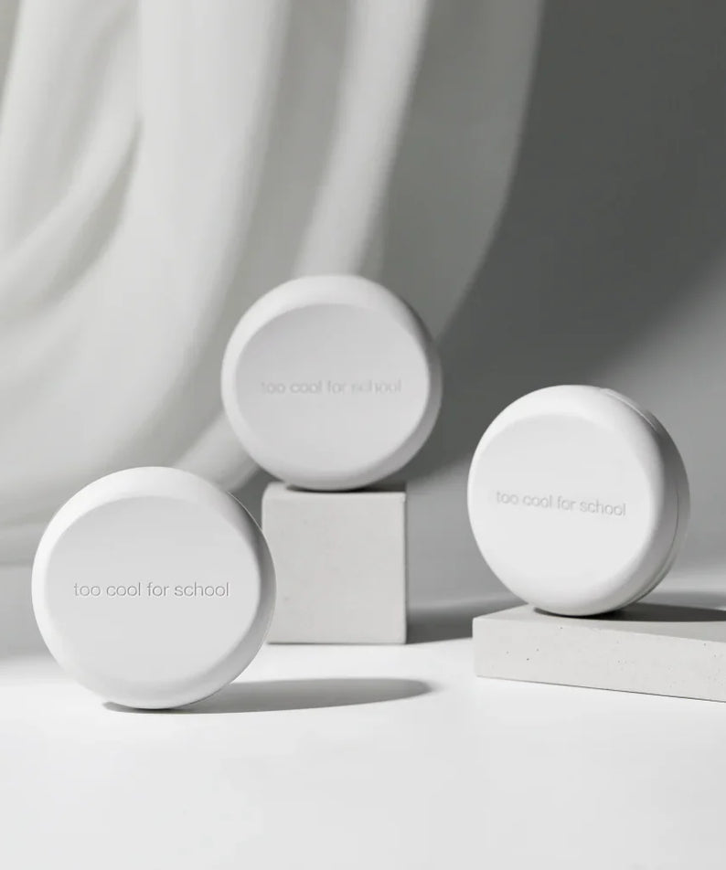 TOO COOL FOR SCHOOL Fixing Cover Cushion (Main Product + Refill) displayed on white pedestal for cosmetic presentation.
