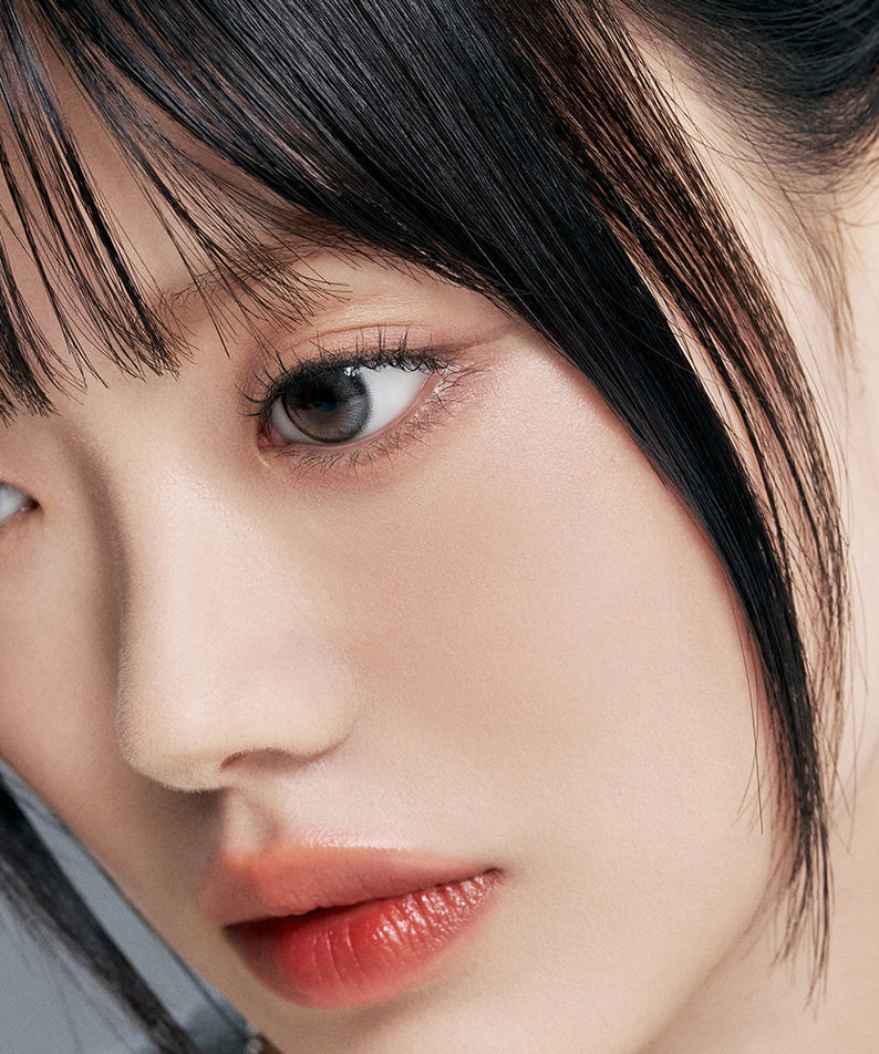 Close-up of person with flawless skin wearing TOO COOL FOR SCHOOL Fixing Nude Fit Cushion [Product + Refill] for a natural look.