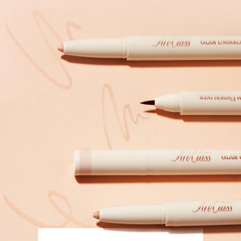 Close-up of TOO COOL FOR SCHOOL Glam Under Liner showcasing different pen tips on a peach background.