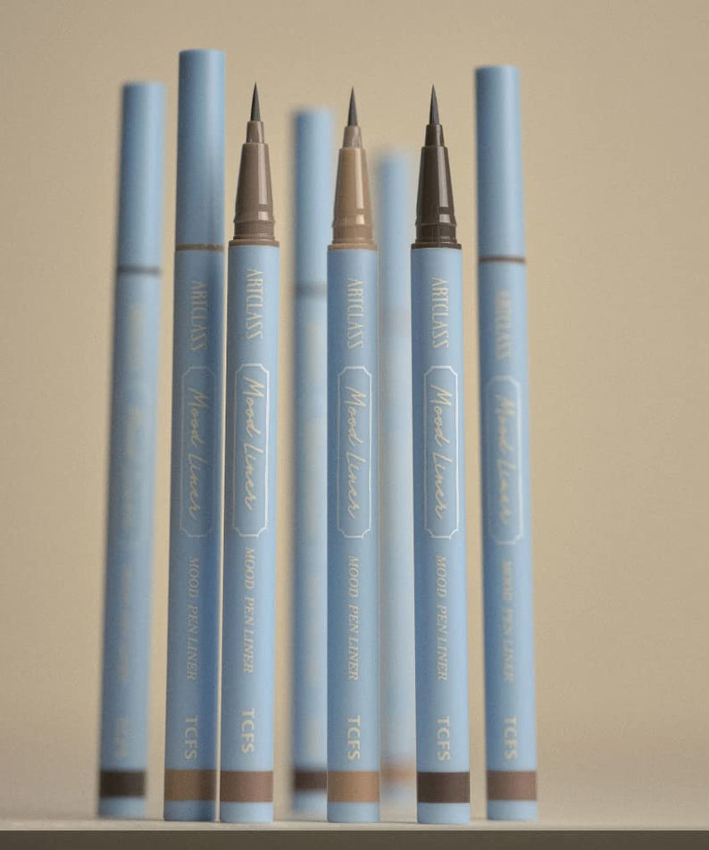 TOO COOL FOR SCHOOL mood pen liner in various shades, displayed vertically on a shelf.