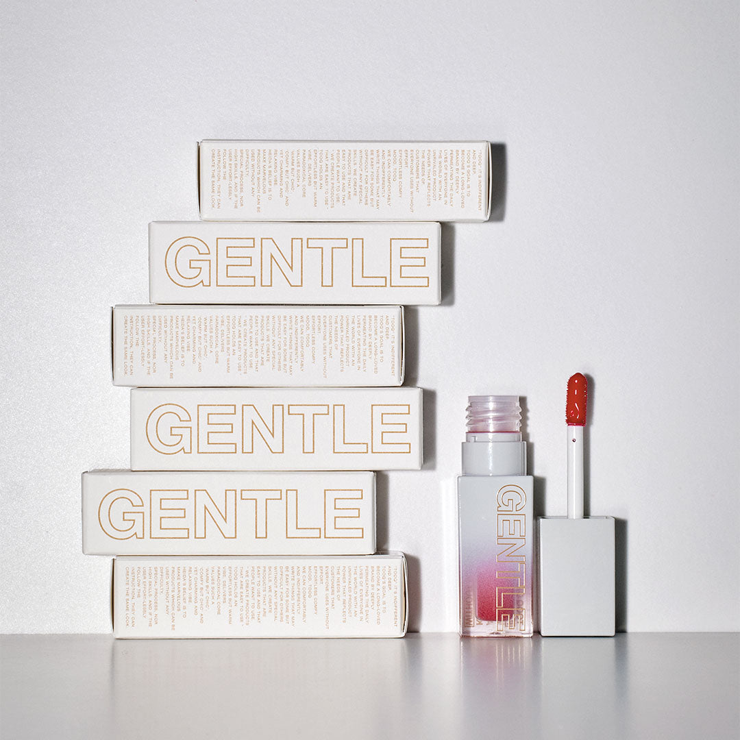 TOOQ Gentle Kiss Glow Tint packaging and open tube with applicator.