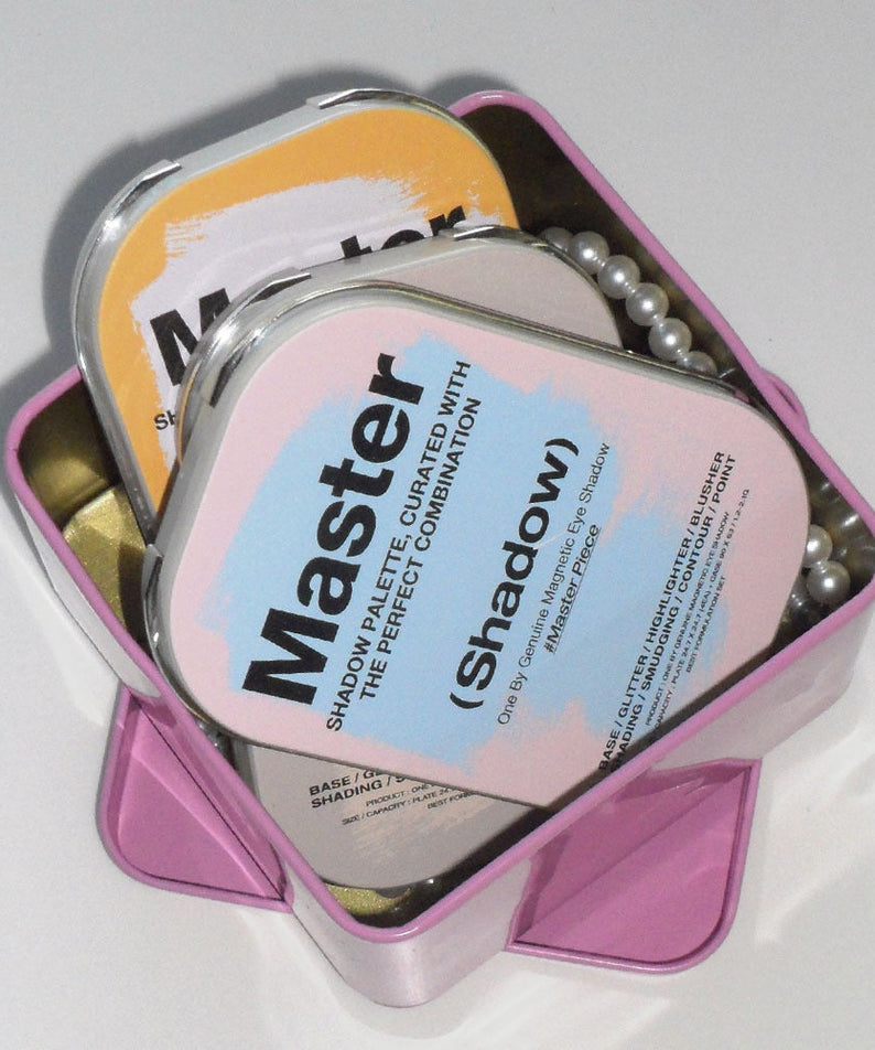 TOOQ Master Piece Face Shadow Palette in pink box showcasing elegant design and vibrant colors for makeup enthusiasts.