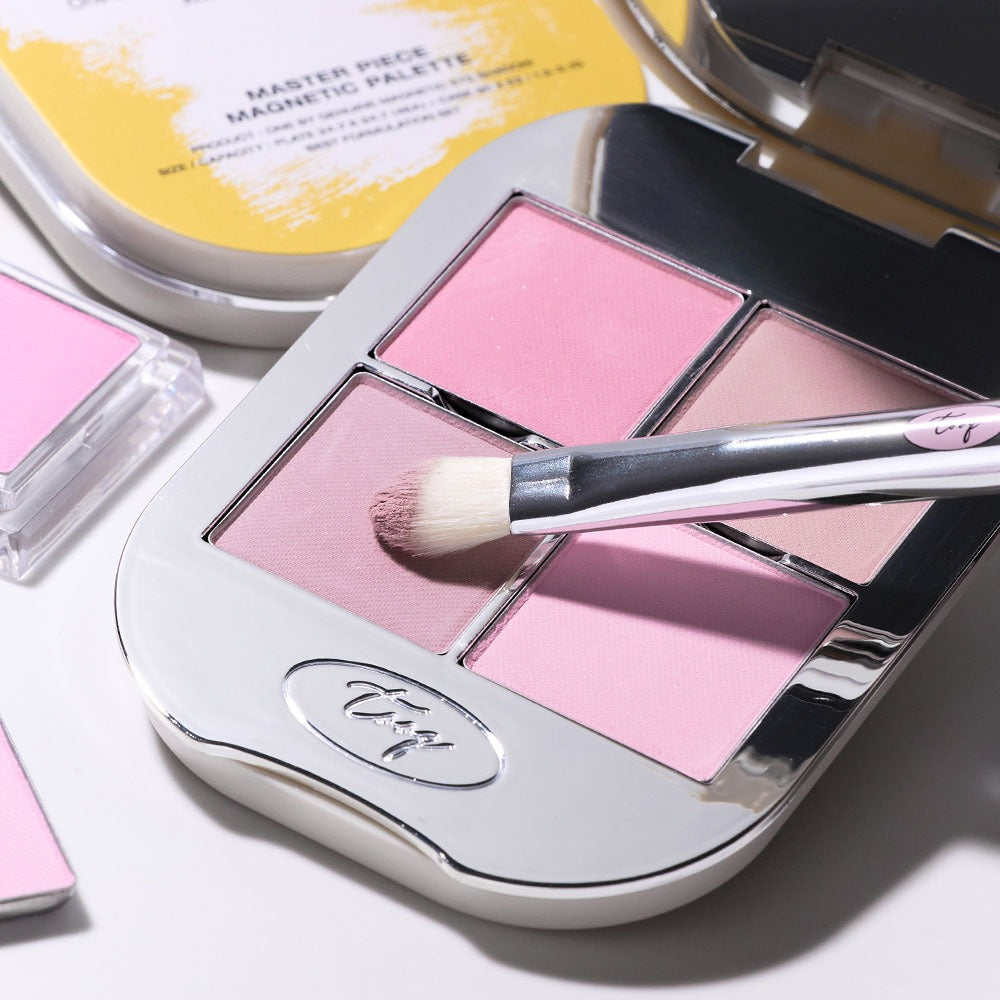 TOOQ Master Piece Face Shadow Palette showcasing pink shades and brush, ideal for enhancing natural beauty and makeup artistry.