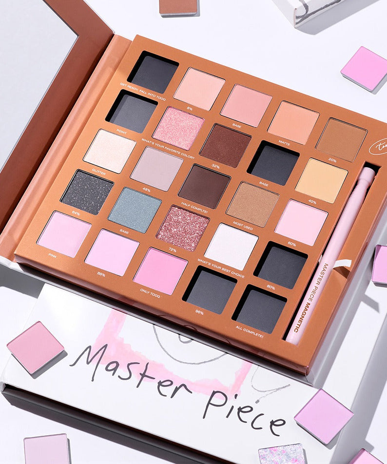 TOOQ One by Genuine Magnetic Shadow 25-Color Palette showcasing vibrant eyeshadow shades in an open palette with brush.
