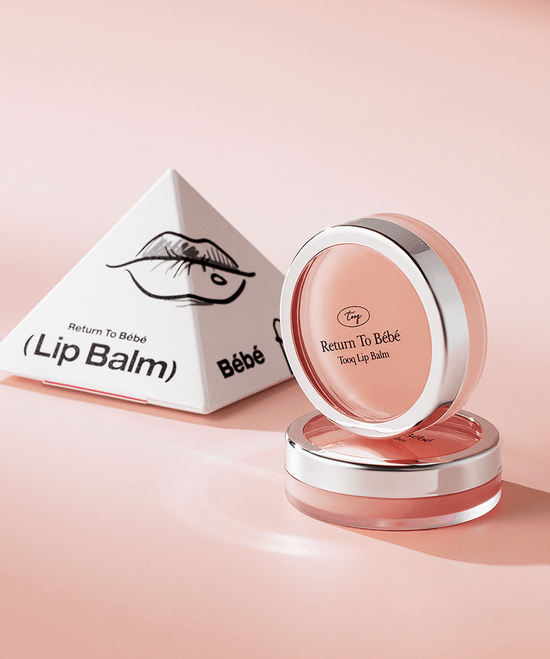 TOOQ Return To BÃ¨bÃ¨ Lip Balm in elegant packaging, featuring a sleek pink container and eye-catching design.