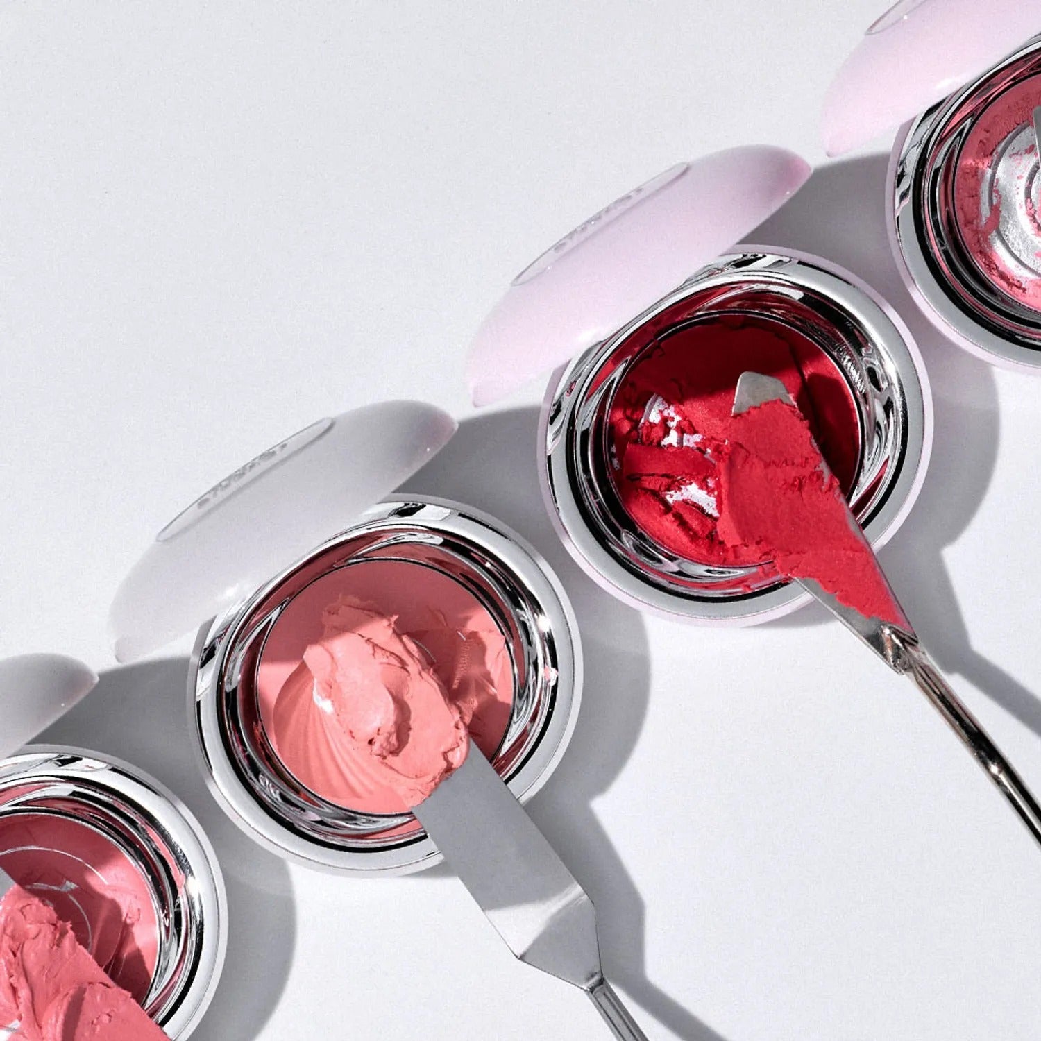 TOOQ Satin Peach Blossom blush and tools in open containers on white background