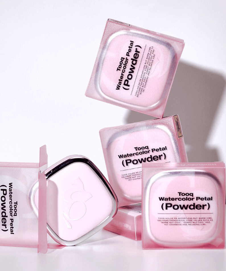 TOOQ Water Color Petal Powder packaging with multiple pink boxes stacked and open, showcasing the elegant design.