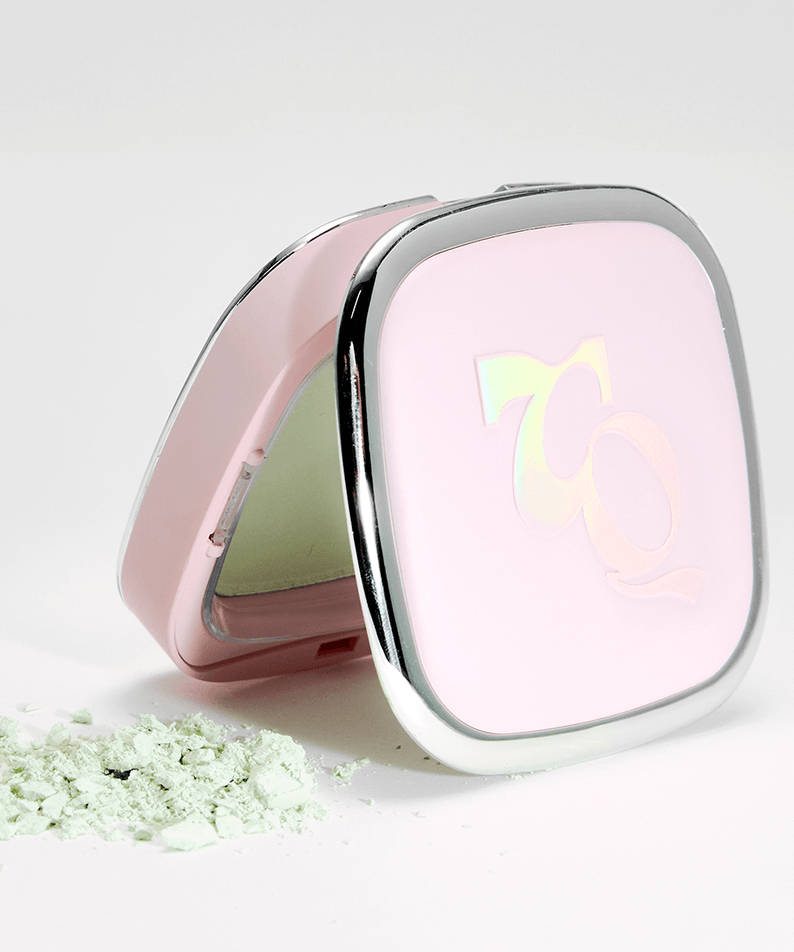 TOOQ Water Color Petal Powder in compact case with scattered green powder