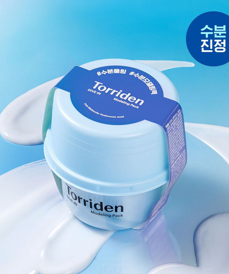 TORRIDEN Dive In Low olecular Hyaluronic Acid Modeling Pack jar on a light blue background with product swirls