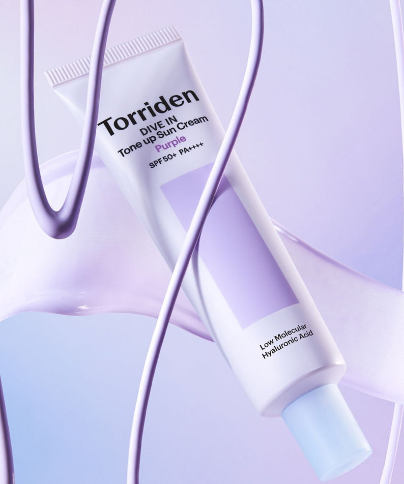 TORRIDEN Dive In Tone Up Sun Cream Purple 50+PA++++ 60ml tube on a lavender background with product highlights visible