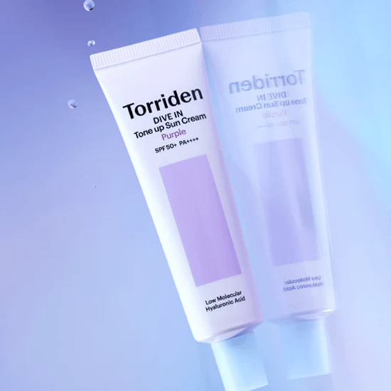 TORRIDEN Dive In Tone Up Sun Cream Purple 50+PA++++ 60ml tube on a reflective surface
