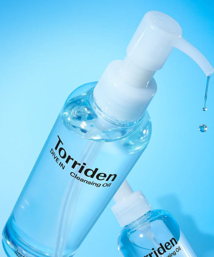 TORRIDEN Dive in Low Molecular Hyaluronic Acid Cleansing Oil 200ml product bottle with dispenser on blue background