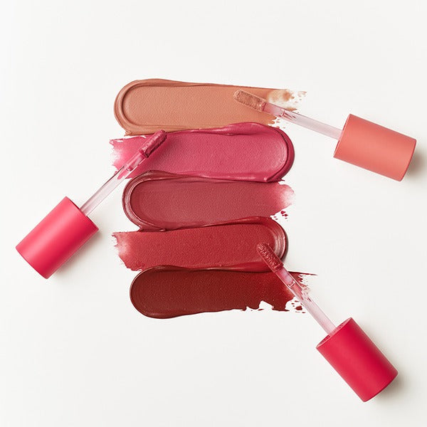 TOUCH IN SOL Vegan Again Blurcore Lip Tint swatches in four shades with applicators on white background