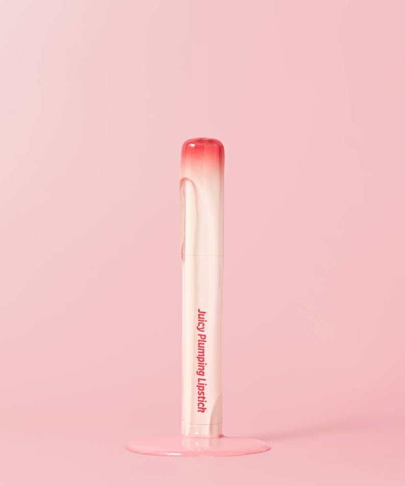 TOUCH IN SOL Vegan Again Juicy Plumping Lipstick on a pink background