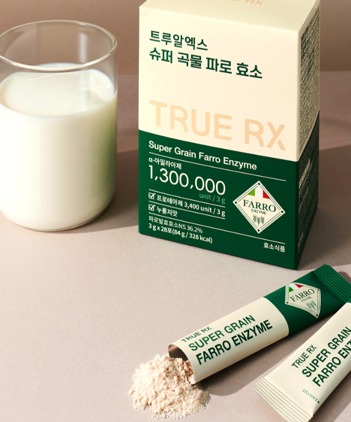 TRUE RX Super Grain Farro Enzyme 28 Packets beside a glass of milk, showing packaging and powder details for nutritional supplementation.