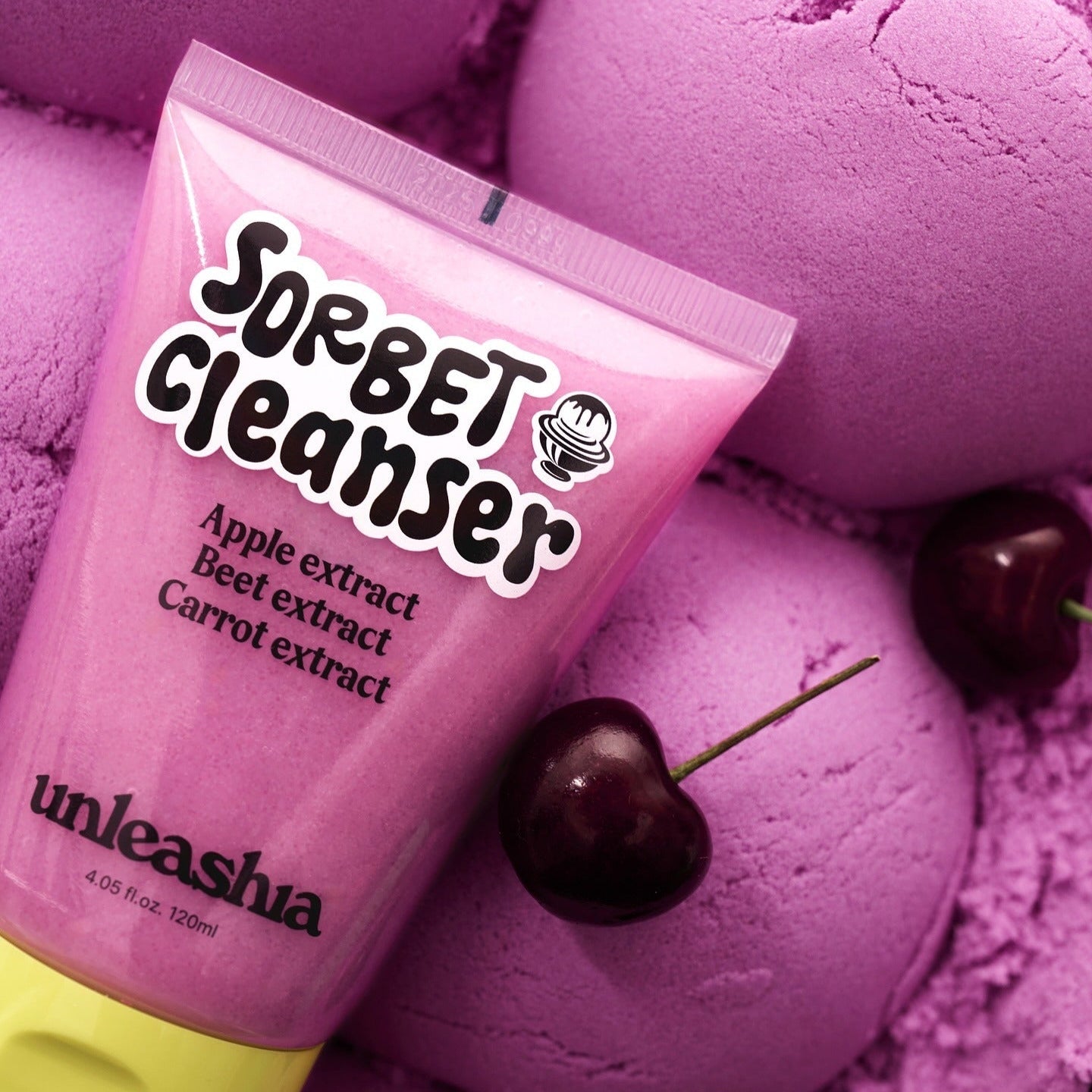 UNLEASHIA ABC Sorbat Facial Cleanser 120ml tube next to cherries and pink spheres