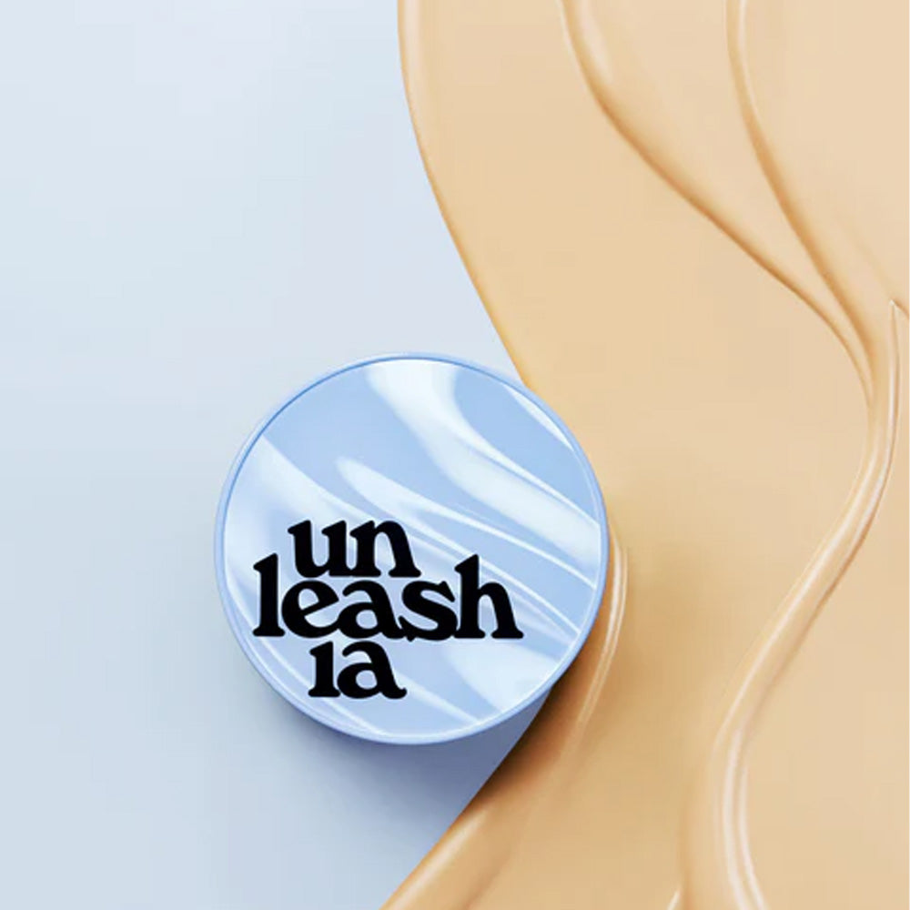 UNLEASHIA Babe Skin Baby Blue Cushion with smooth beige background