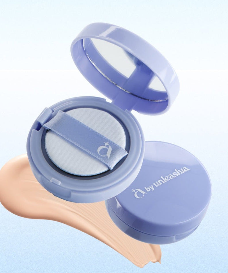 UNLEASHIA Be Be Blue Cushion makeup compact with cushion puff and foundation swatch on background