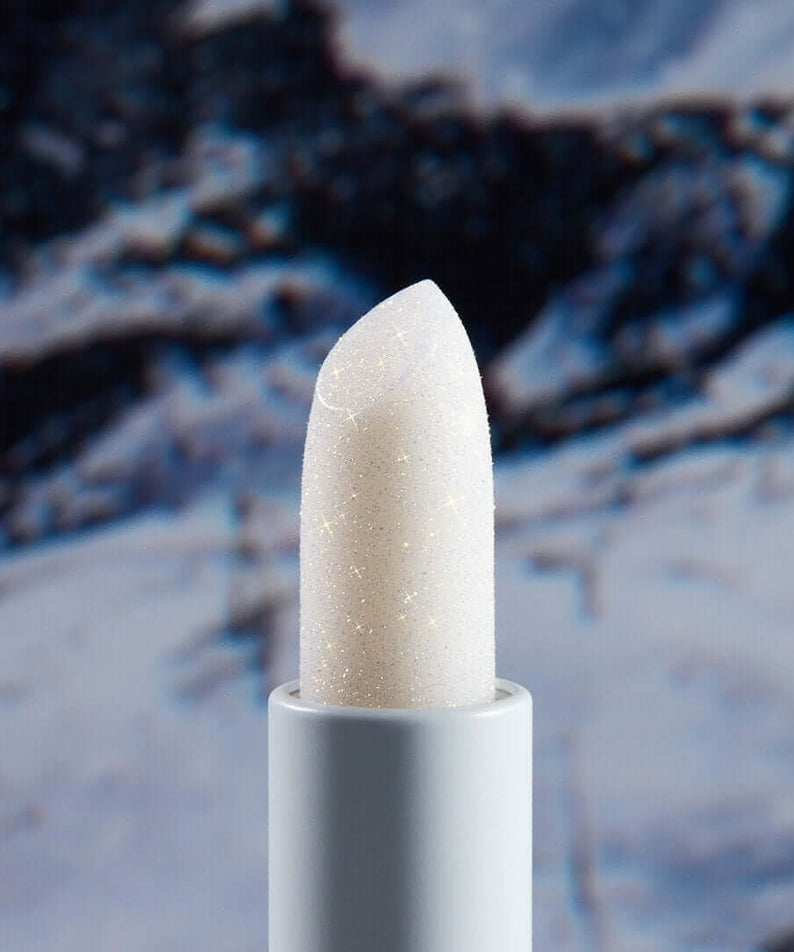UNLEASHIA Glacier Vegan Lip Balm against snowy background