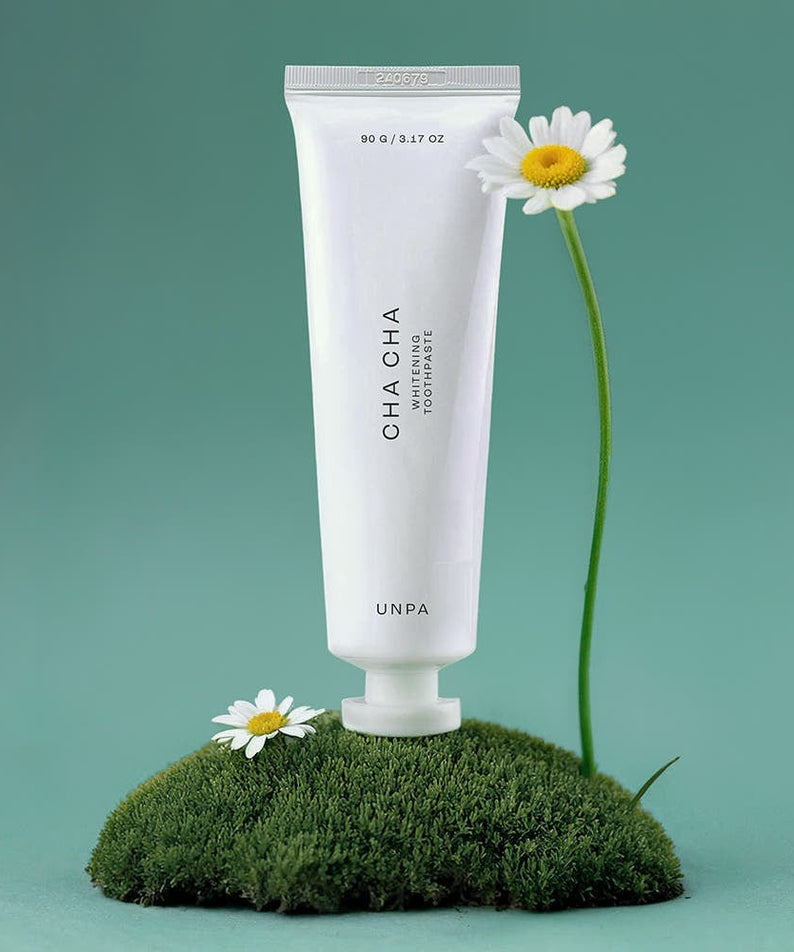 UNPA Chacha French Chamomile Vegan Whitening Toothpaste 90g displayed with chamomile flowers and green background