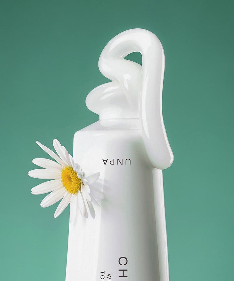 UNPA Chacha French Chamomile Vegan Whitening Toothpaste 90g featuring chamomile flower on green background.
