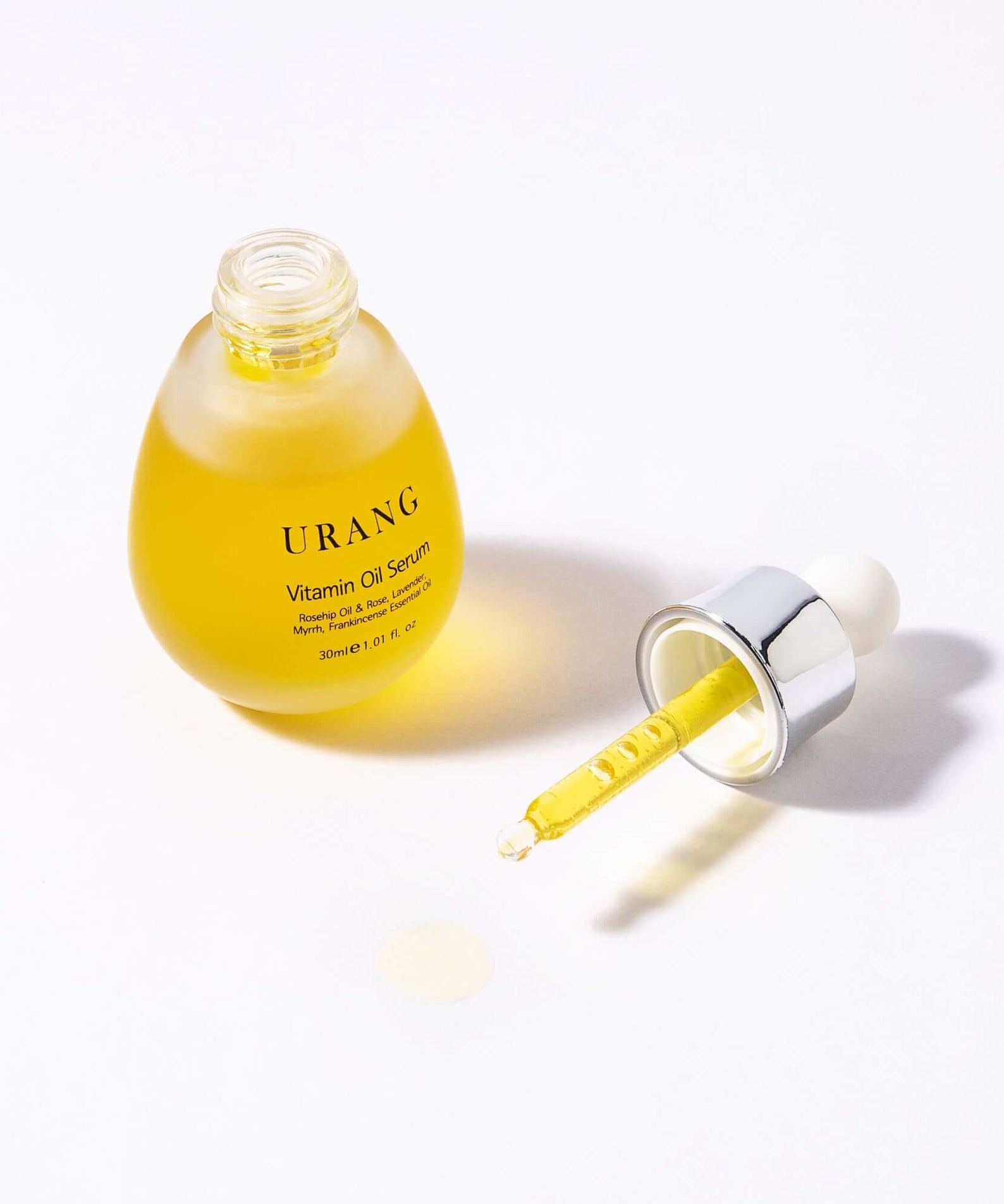 URANG Glow Oil Serum 30ml bottle with dropper on white background