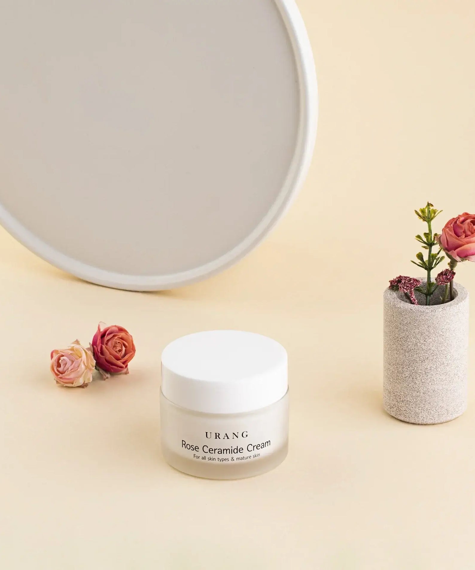 URANG Rose Ceramide Cream 50ml displayed next to decorative flowers.