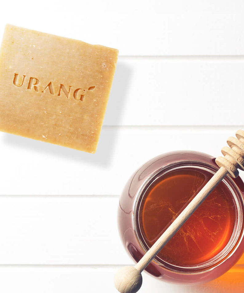URANG Sweet Honey & Milk CP Handmade Soap next to jar of honey on white background